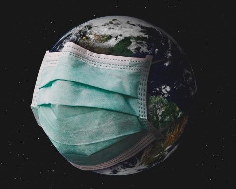 Planet earth with surgical mask.